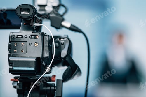 Preview: Camera Recording at a Press Conference.