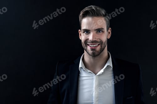 Preview: Portrait of happy smiling businessman isolated on black background