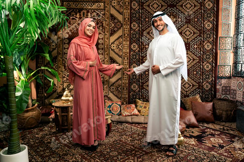 Preview: Young couple from Emirati spending time in a cafe