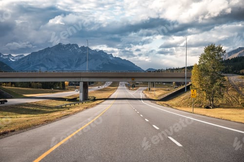 Preview: Road trip travel driving on highway with rocky mountains and cloudy sky at Banff national park