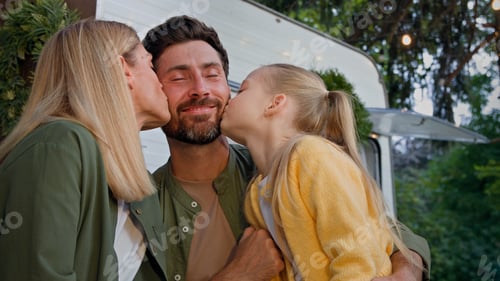 Preview: Caucasian happy loving family talking outdoors dad touching nose of little daughter child girl and