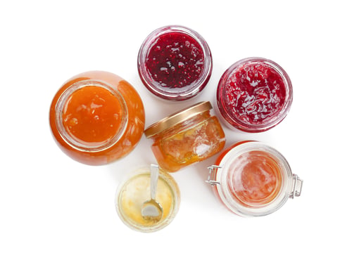 Preview: Jars with different sweet jam on white background