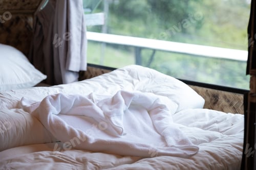 Preview: Towels heart shape on the bed in the luxury hotel or resort room ready for tourist travel