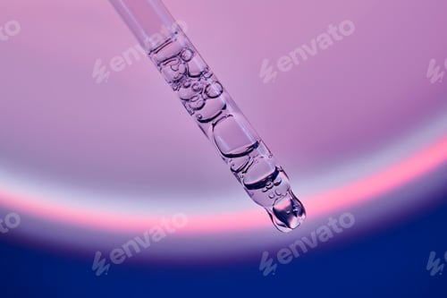 Preview: Pipette with serum in a space atmosphere.