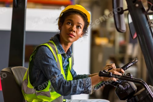 Preview: women worker at forklift driver happy working in industry factory logistic ship