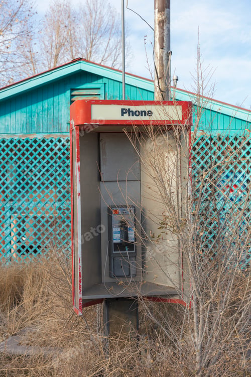 Preview: Abandoned old phone booth and deserted store by the roadside.