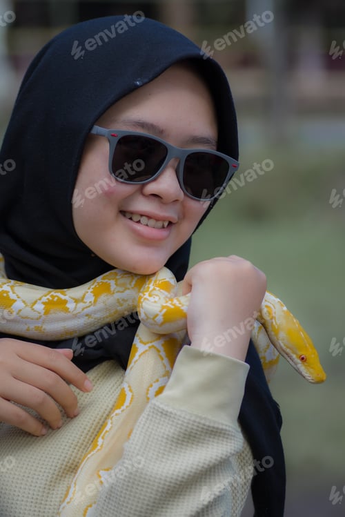 Preview: girl playing with a snake