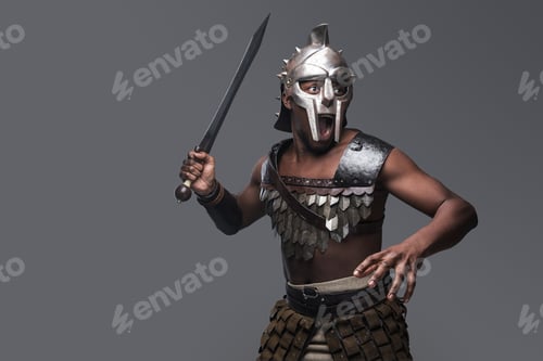 Preview: Violent gladiator with sword against gray background