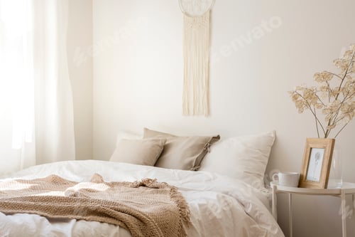 Preview: Macrame above comfortable king size bed with white bedding, beig