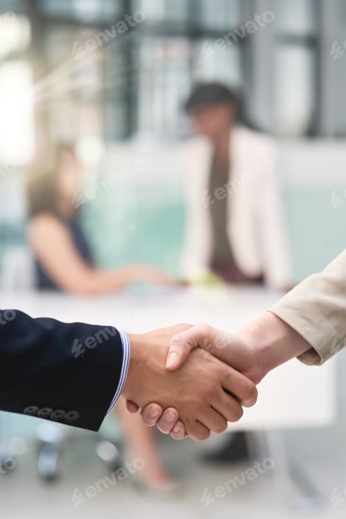 Preview: Creating lasting business relationships. Shot of businesspeople shaking hands in an office.