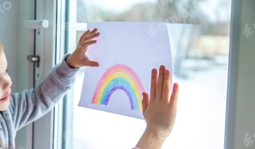 Preview: drawn rainbow on a sheet. Children hold a leaf with a rainbow near the window.
