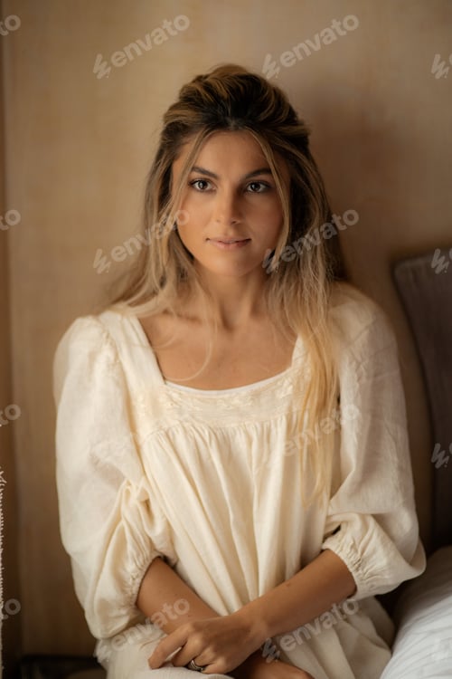 Preview: The beautiful young woman with well-groomed skin and dressed in an evening dress