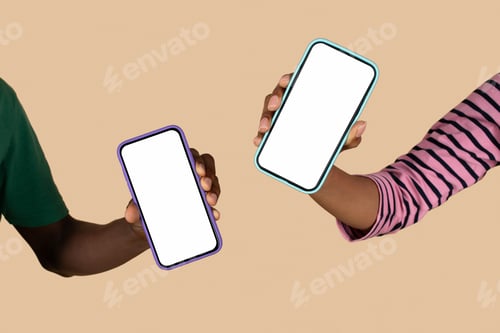 Preview: Hands of millennial black husband and wife hold smartphones with empty screen, isolated on beige