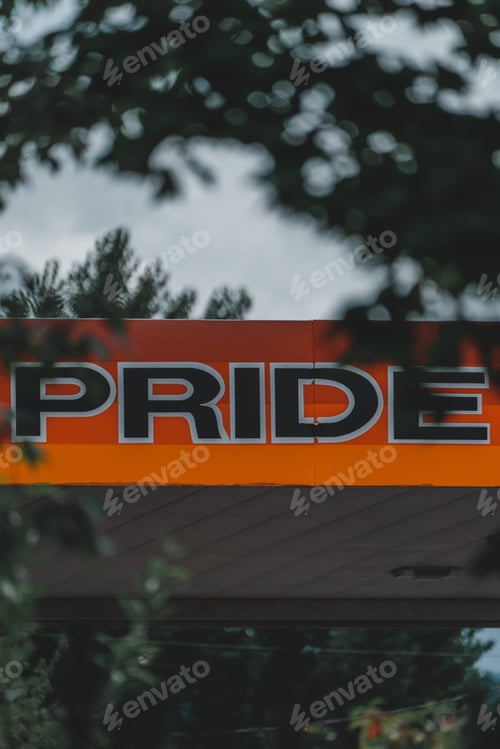 Preview: Vertical shot of a pride sign on an orange and red board