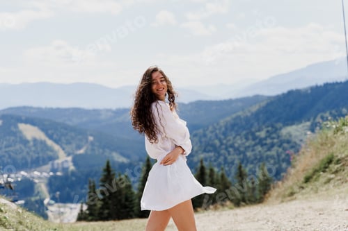 Preview: Girl traveler smiling on green hills. Promo for travel agency. Tourism photography.