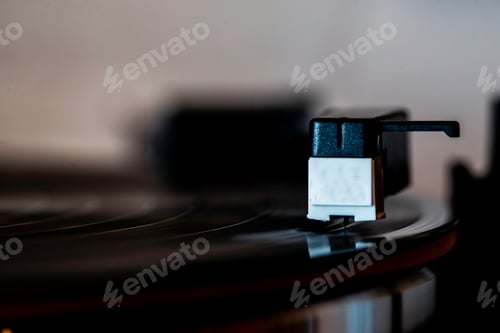 Preview: a single vinyl player is playing on a record board and its blades are on the