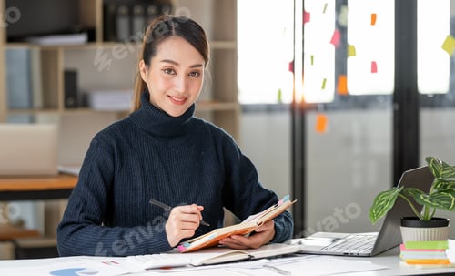 Preview: Beautiful businesswoman smiling to camera sitting at open office.