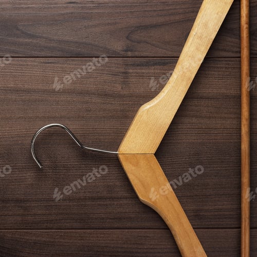Preview: Wooden Hanger on a Dark Wooden Background