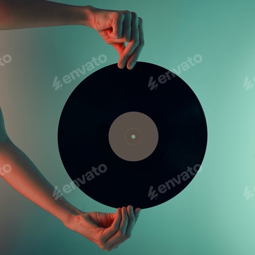 Preview: Woman hold retro vinyl disc in hands, toned photo
