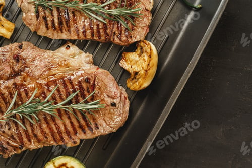 Preview: Beef steaks with vegetables on grill pan
