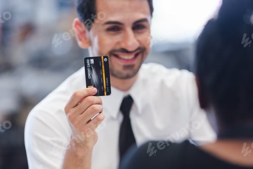 Preview: Male customers paying by credit card at counter in auto parts stores. business warehouse motor vehic