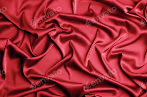 Preview: Delicate red silk fabric as background, top view
