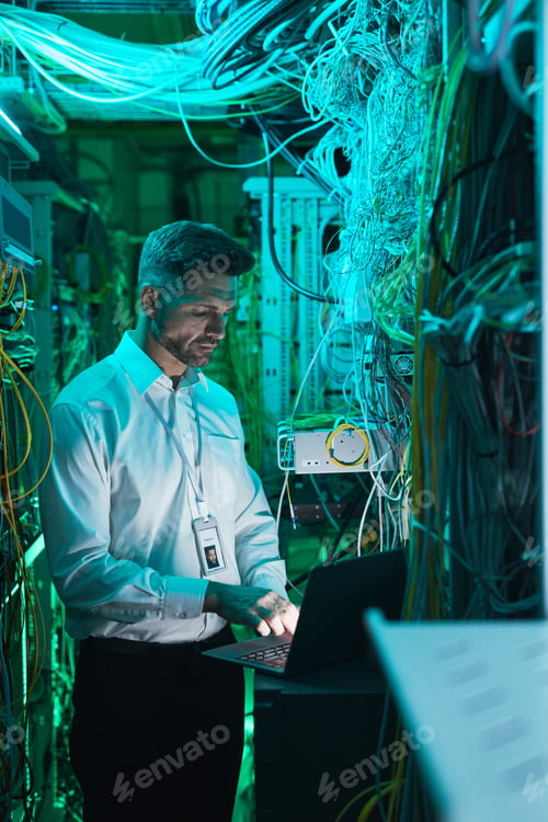 Preview: Mature Engineer Setting Up Network