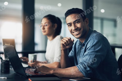 Preview: I keep my faith strong. Portrait of a young man using a laptop in a modern office.