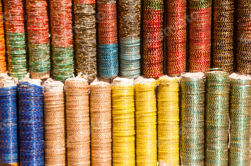 Preview: Background of colorful bangles stacked in a shop in India