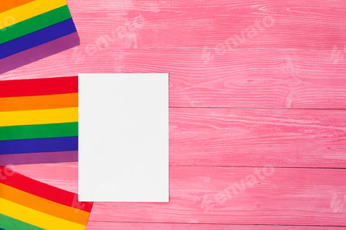 Preview: Bright rainbow gay flag on wooden background and blank space
