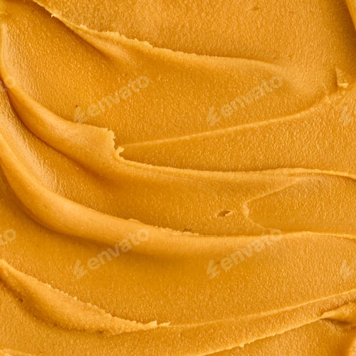 Preview: Tasty peanut butter smear macro shot. Closeup of textured smooth nut food