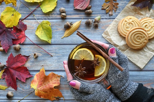 Preview: Autumn Tea flat lay - spiced lemon tea being enjoyed outside, fall leaves acorns, cookies