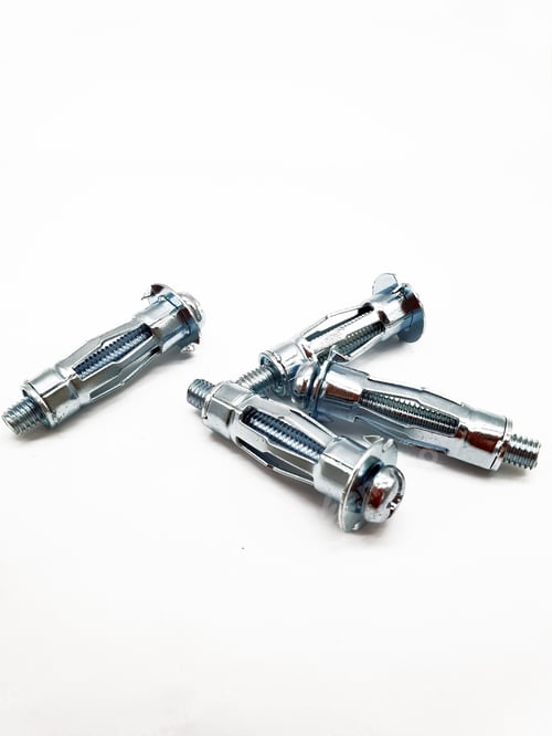 Preview: Vertical shot of hollow wall anchors on a white background