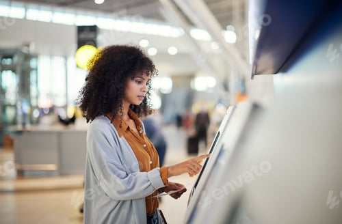 Preview: Black woman, airport and self service station for ticket, registration or online boarding pass. Afr