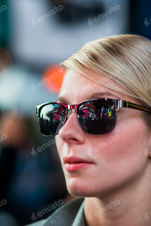 Preview: Woman with Time Square Buildings Reflection in Sunglasses at Nig