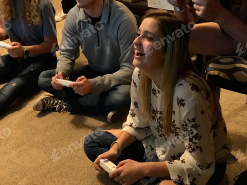 Preview: Friends Having Fun Playing Video Games Indoors