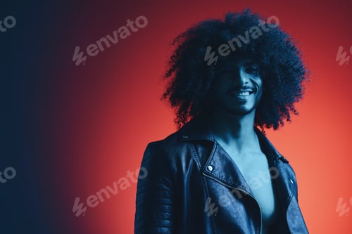 Preview: Portrait of fashion man with curly hair on red background multinational, colored light, black