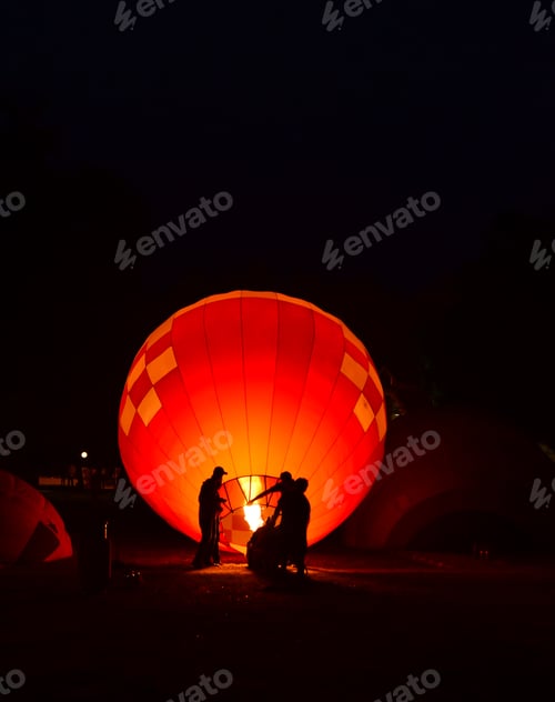 Preview: The team is preparing a balloon with a fire to make the balloon rise.