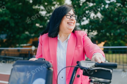 Preview: Excited business woman renting a bicycle from public transportation so she can tour the city freely.