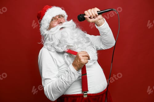 Preview: Caucasian Santa Claus singing with microphone