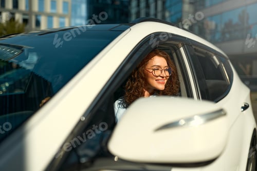 Preview: Woman sitting in a car