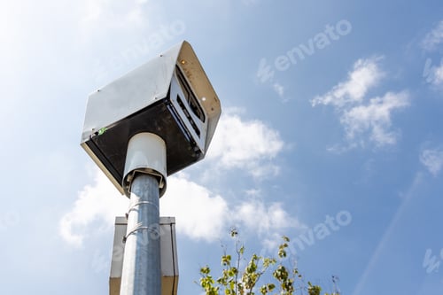 Preview: Close-up on speed trap surveillance camera along highway.