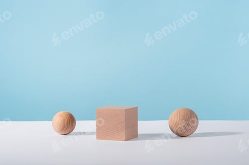 Preview: Wooden cube podium with sphere on blue background for cosmetic or jewellery showcase. Creative