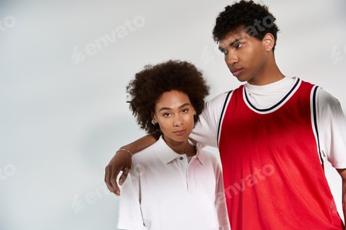 Preview: Stylish young couple embracing love with confidence in a minimalist setting