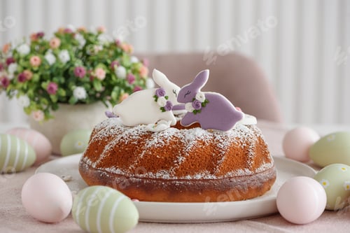 Preview: Traditional easter cakes with icing decorated with gingerbread cookies in shape of rabbits