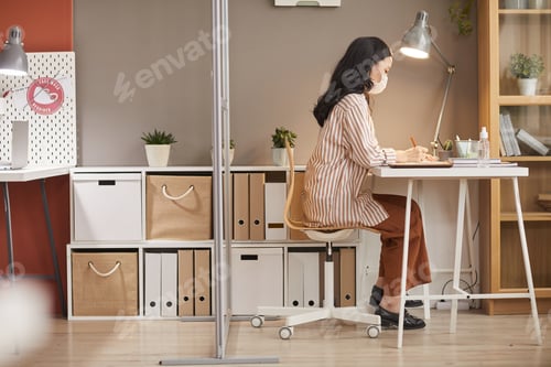Preview: Asian Woman Working in Cubicle