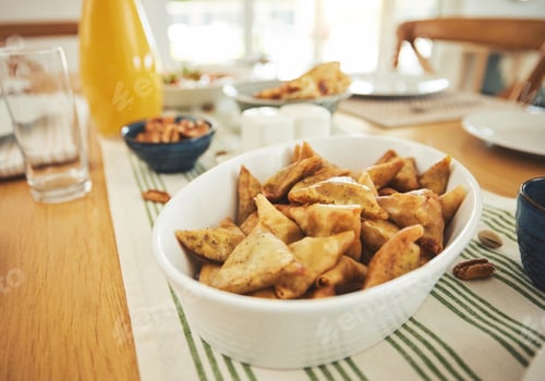 Preview: Food, Eid Mubarak and samosa for family at table for Islamic celebration, festival and lunch togeth