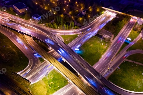 Preview: Night Aerial view of a freeway intersection traffic trails in ni