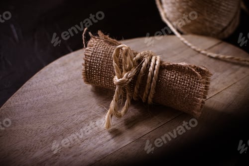 Preview: Hemp cloth and rope on wooden background