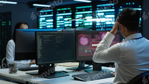 Preview: Engineer in server hub frightened by hacker passing company firewall